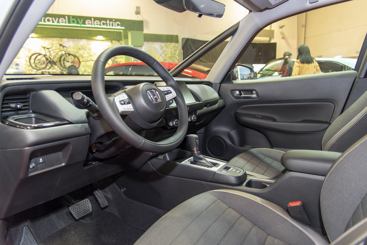 Steering wheel and center console with gear shift in a car interior