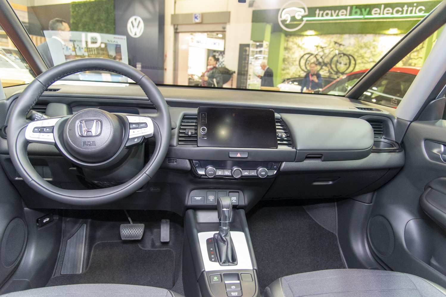 Modern car interior with dashboard and multifunction steering wheel