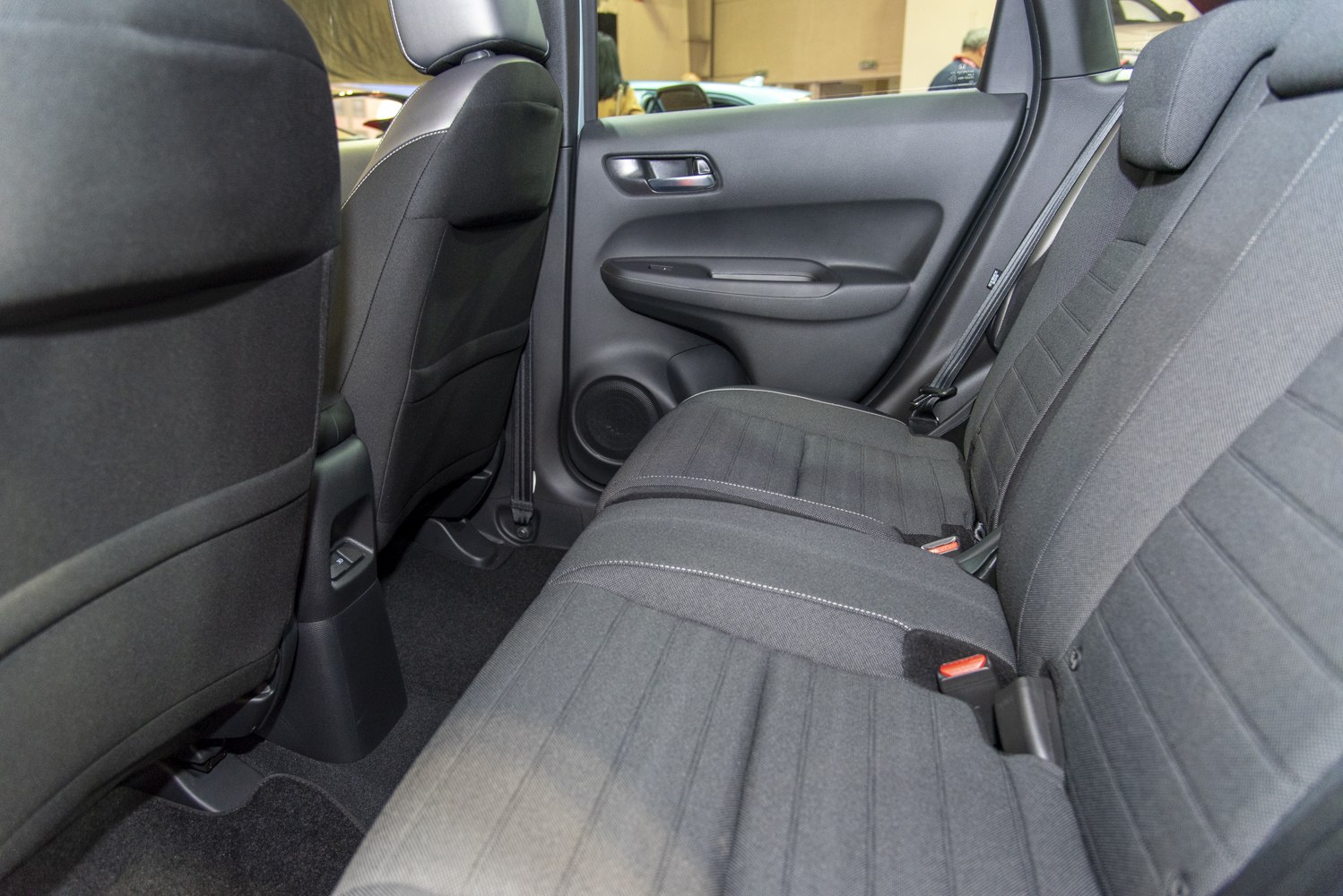Rear seat with fabric upholstery and spacious legroom inside compact car