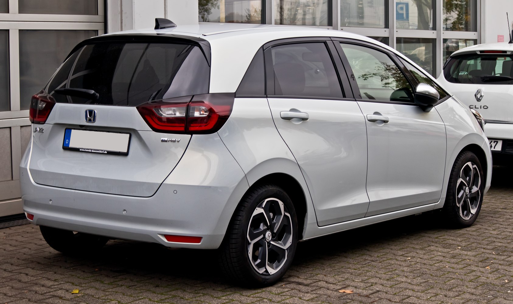 Rear side profile with taillights and alloy wheels
