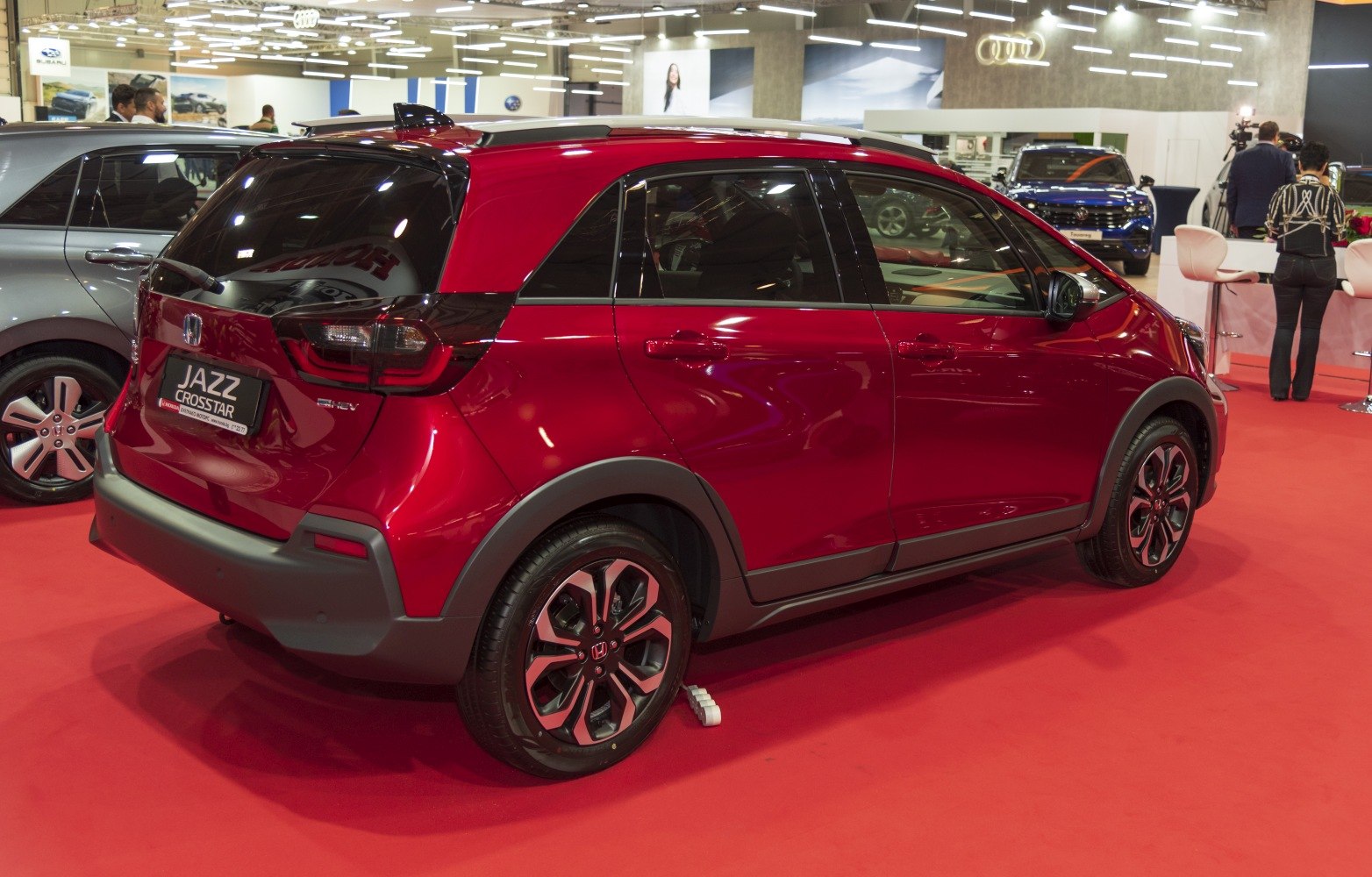 Rear-side view of a compact hatchback with black cladding and alloy wheels
