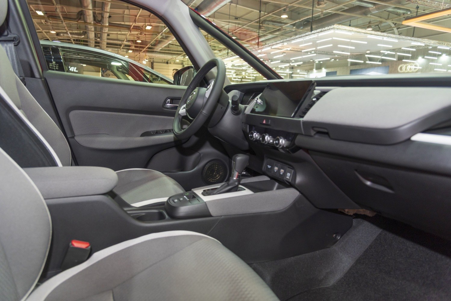 Modern dashboard and front seating interior with controls and gear shift