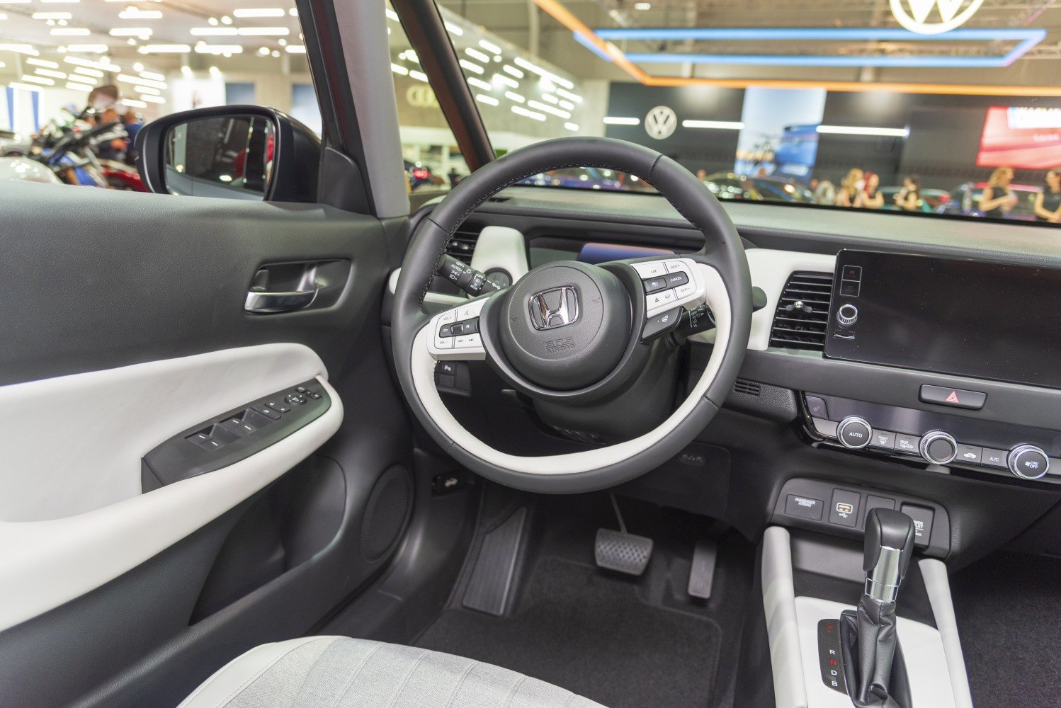 Steering wheel with integrated controls and modern dashboard layout.