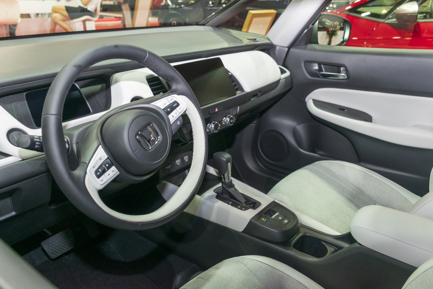 Modern car interior with sporty steering wheel and central touchscreen