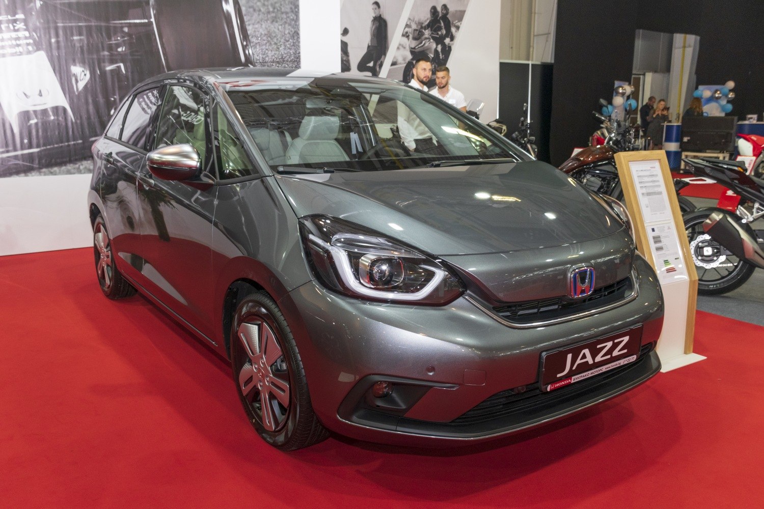 Front view of compact hatchback with LED headlights and aerodynamic shape