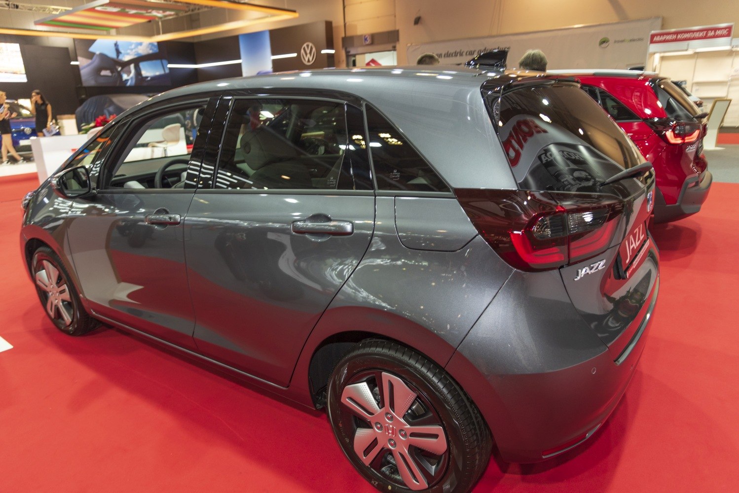 Compact hatchback rear and side view with sleek tail lights and smooth body lines