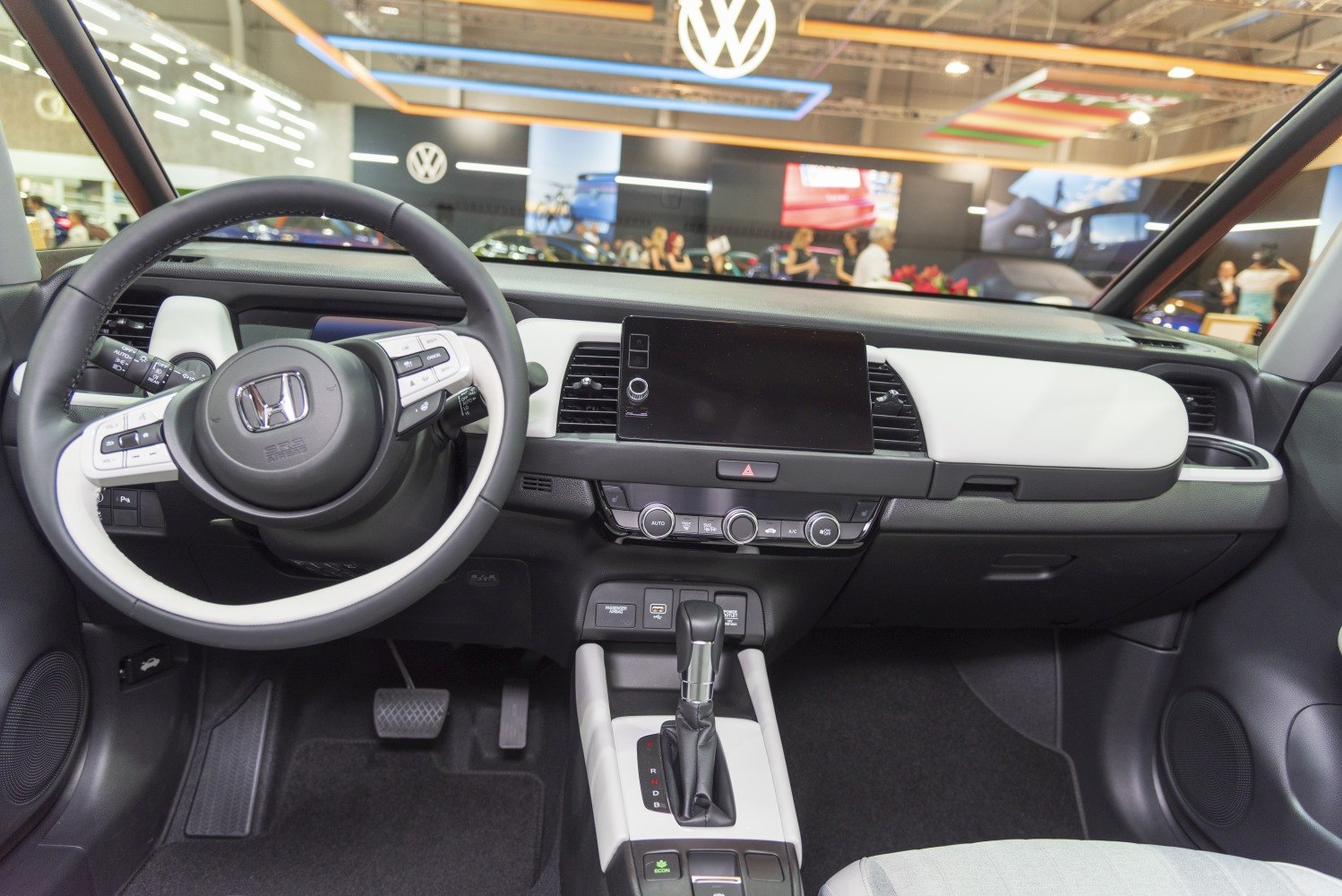Modern dashboard and multifunction steering wheel in a compact car interior