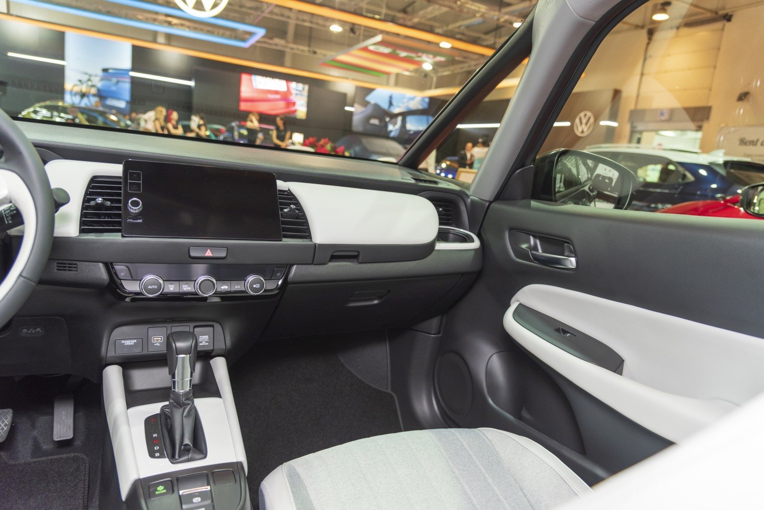 Digital touchscreen, automatic gear lever, and two-tone interior trims