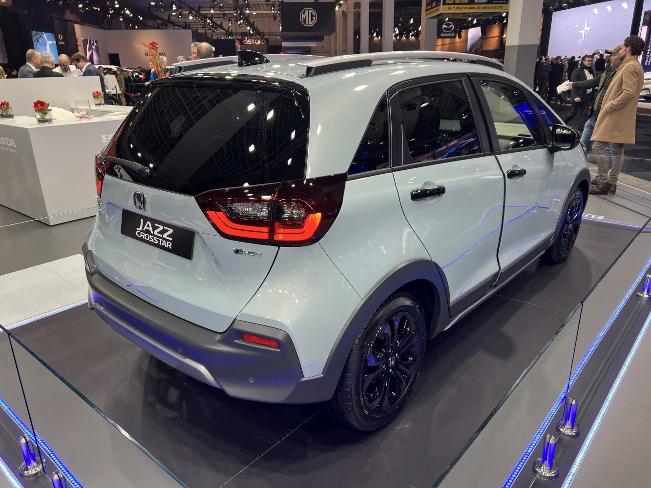 Rear three-quarter view of a hatchback with black alloy wheels and distinctive rear lights.