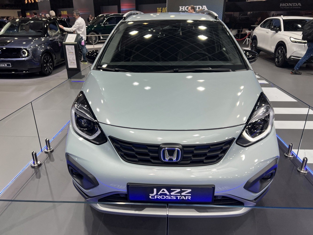 Front view of a vehicle with distinctive grille and headlights.