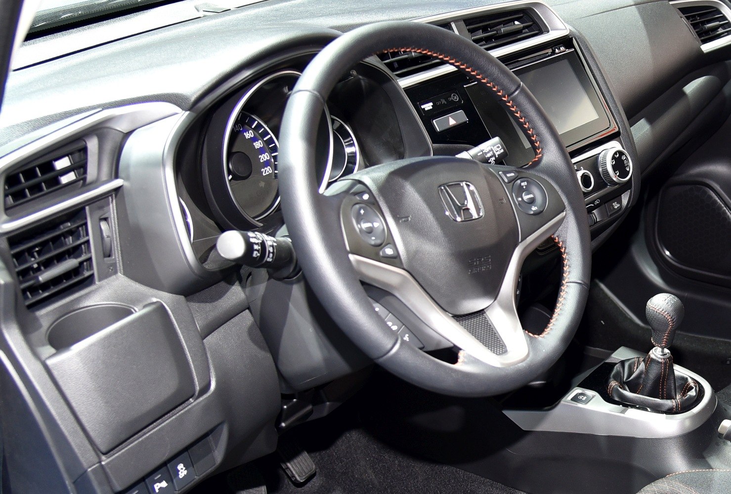 Steering wheel, dashboard, and gear shift lever close-up