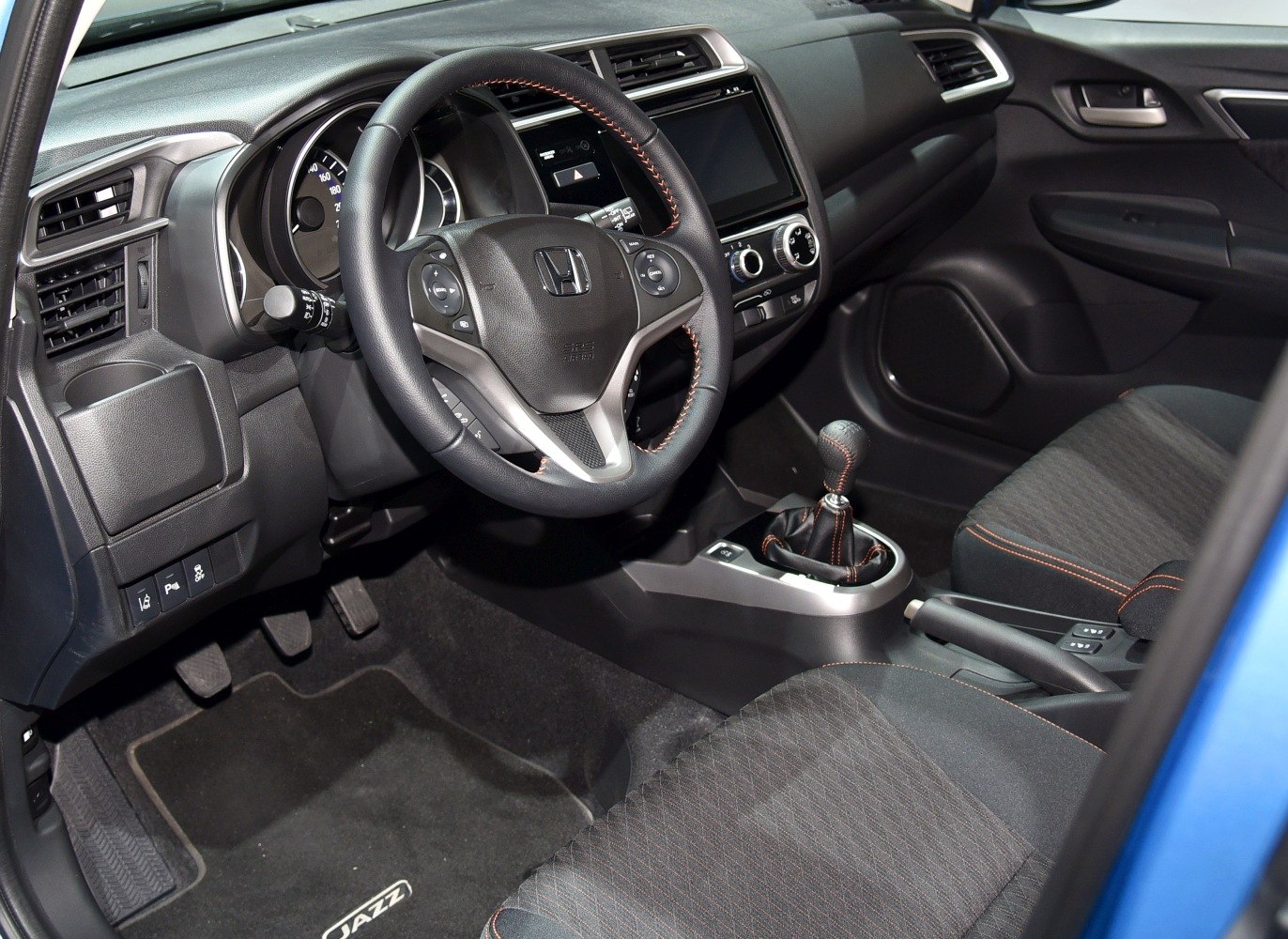 Manual gear interior with steering wheel and dashboard controls