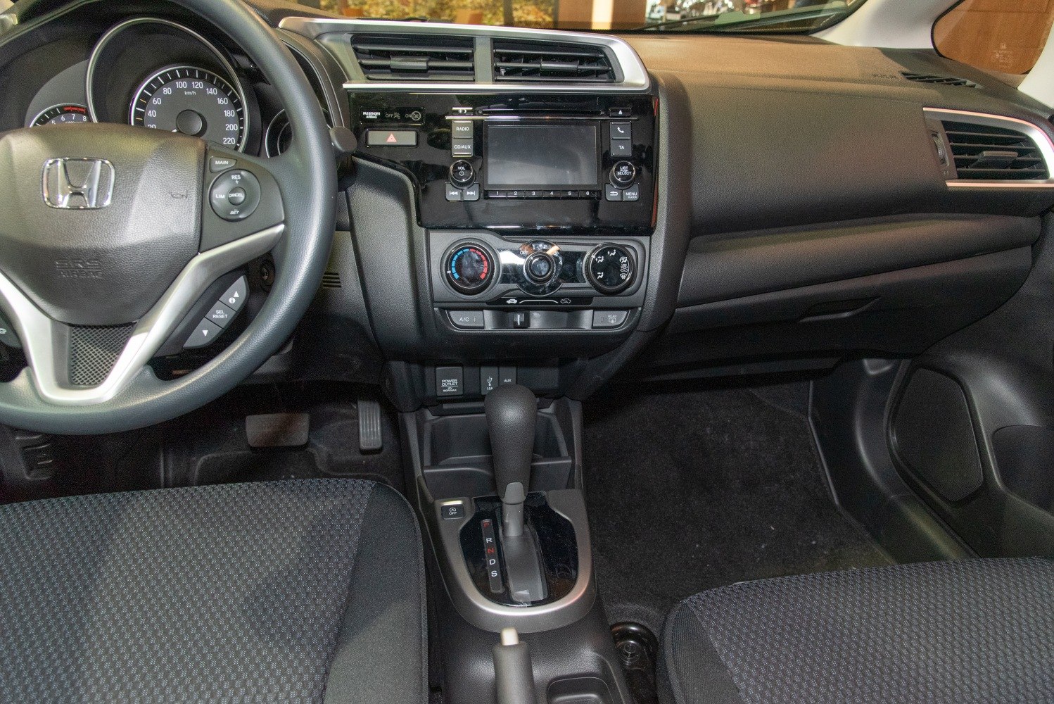 Steering wheel, dashboard, center console with gear shifter