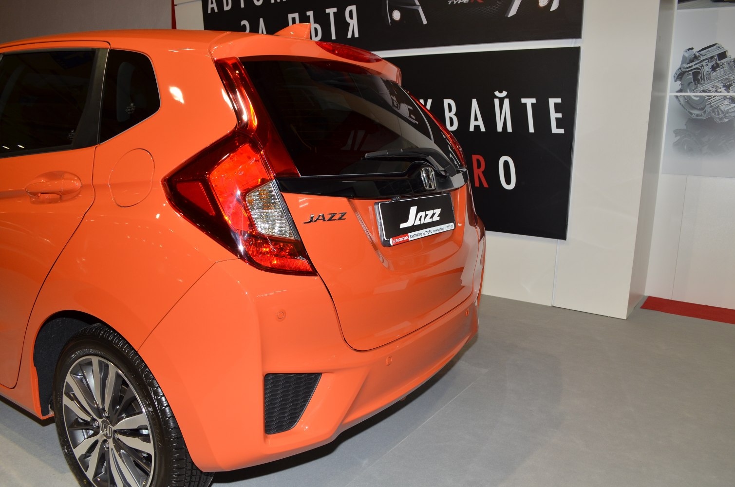 Distinctive rear tail lights and rear hatch design with sporty wheel.