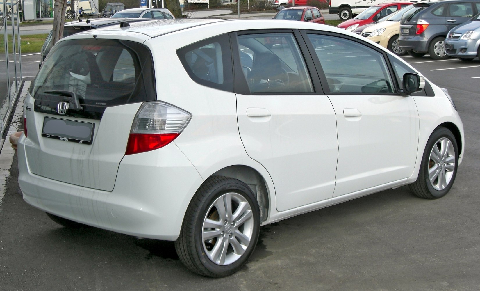 Rear side view of a five-door hatchback with alloy wheels and distinct rear lights