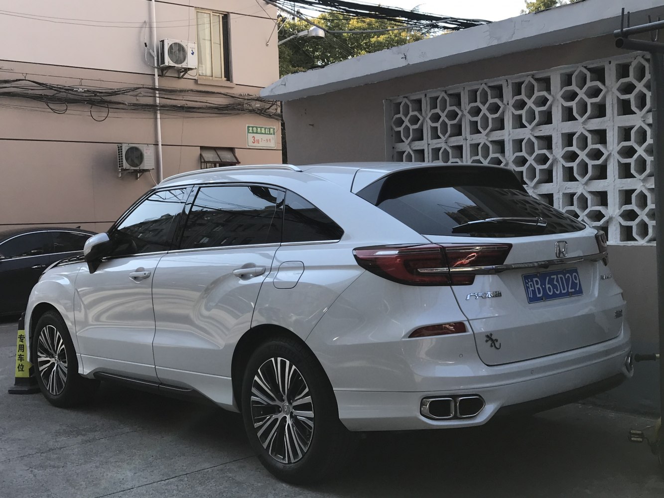 Modern facelift SUV rear with dual exhausts and tinted windows