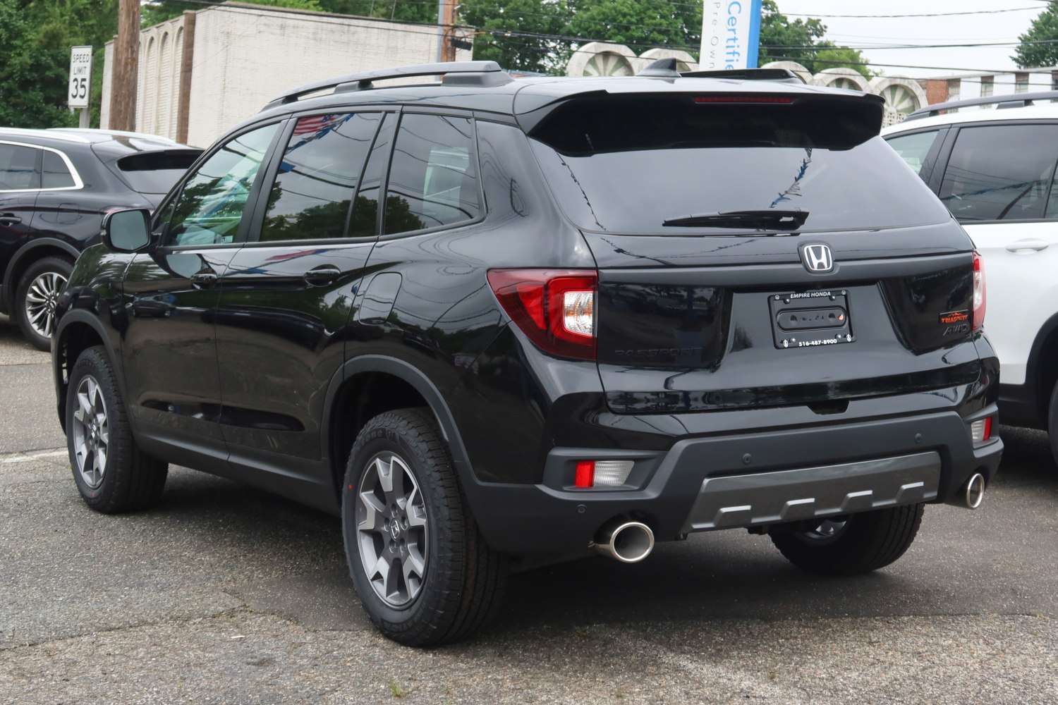 SUV rear view with dual exhaust and roof rails
