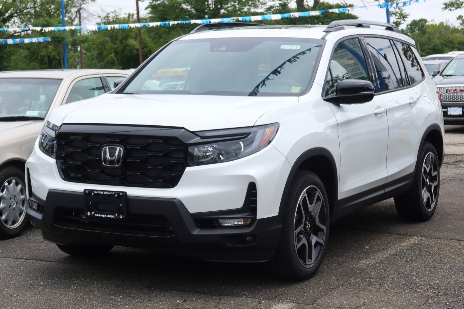 Front and side view of a modern mid-size SUV with bold grille and alloy wheels