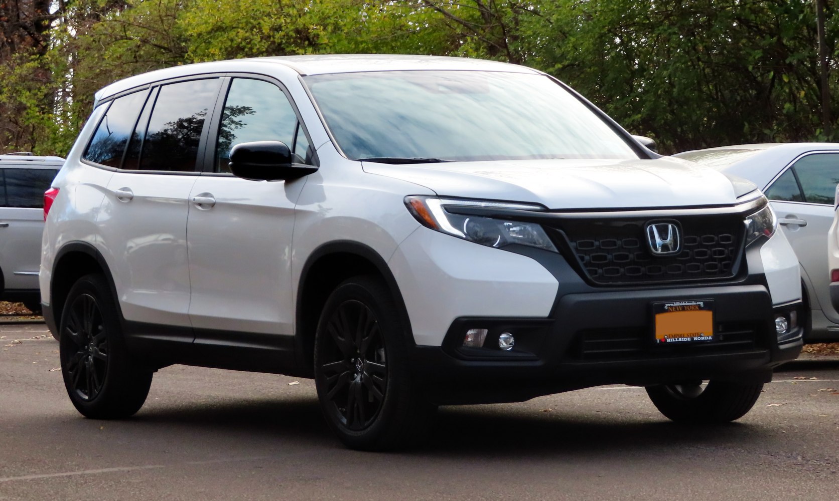 Modern SUV front grille and black alloy wheels