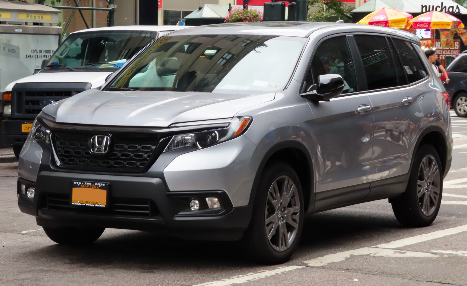Front three-quarter view of an SUV with distinctive grille and headlight design