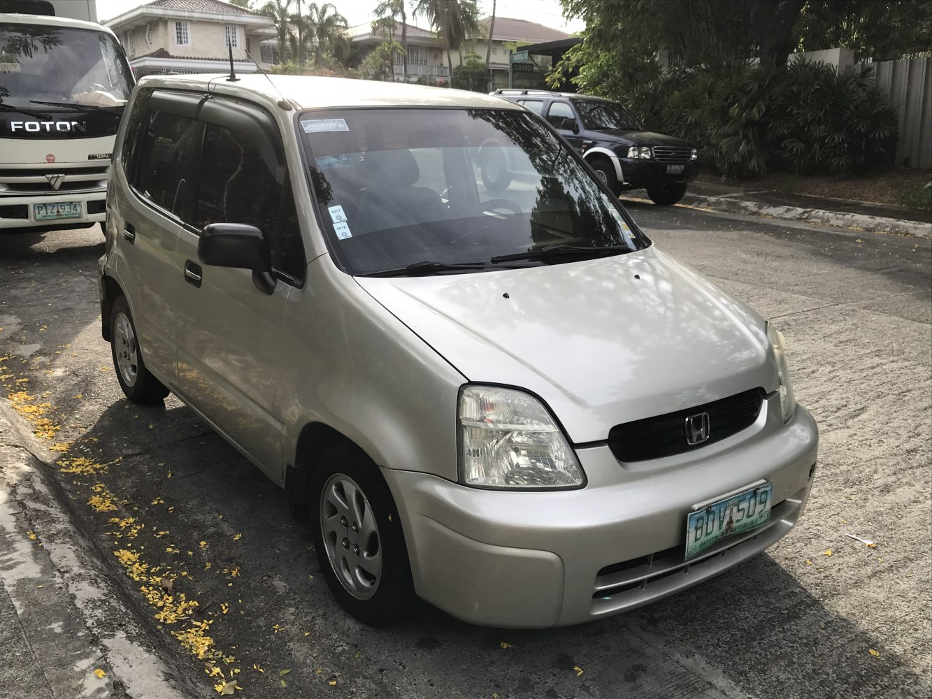 Compact hatchback front three-quarter view with distinct headlights