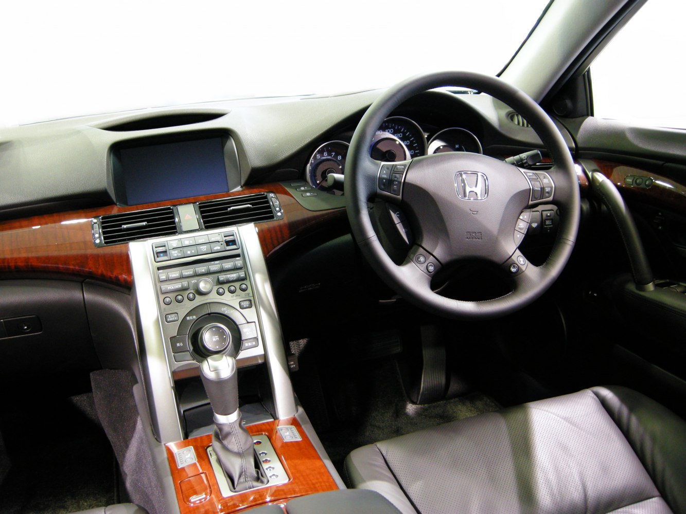 Dashboard with multifunction steering wheel and wood-trimmed center console