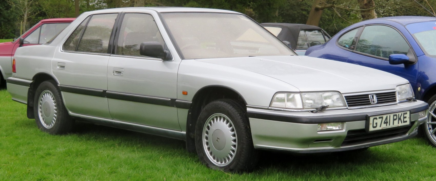 Classic 1980s sedan with alloy wheels and four-door design