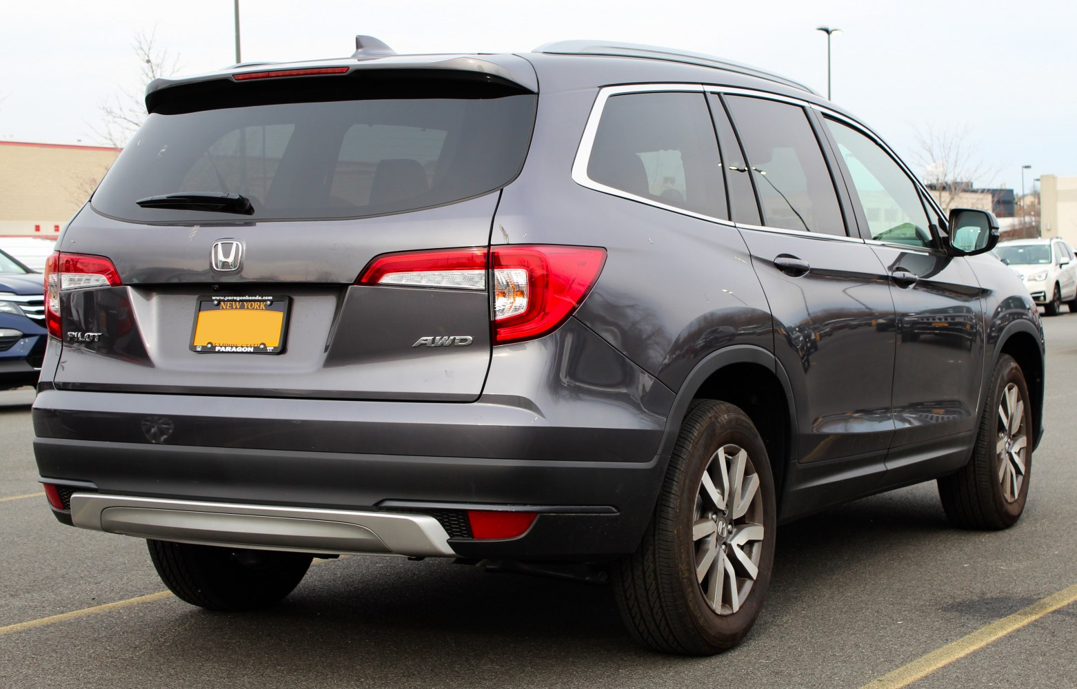 Rear view of SUV with LED taillights, chrome trim, AWD badge