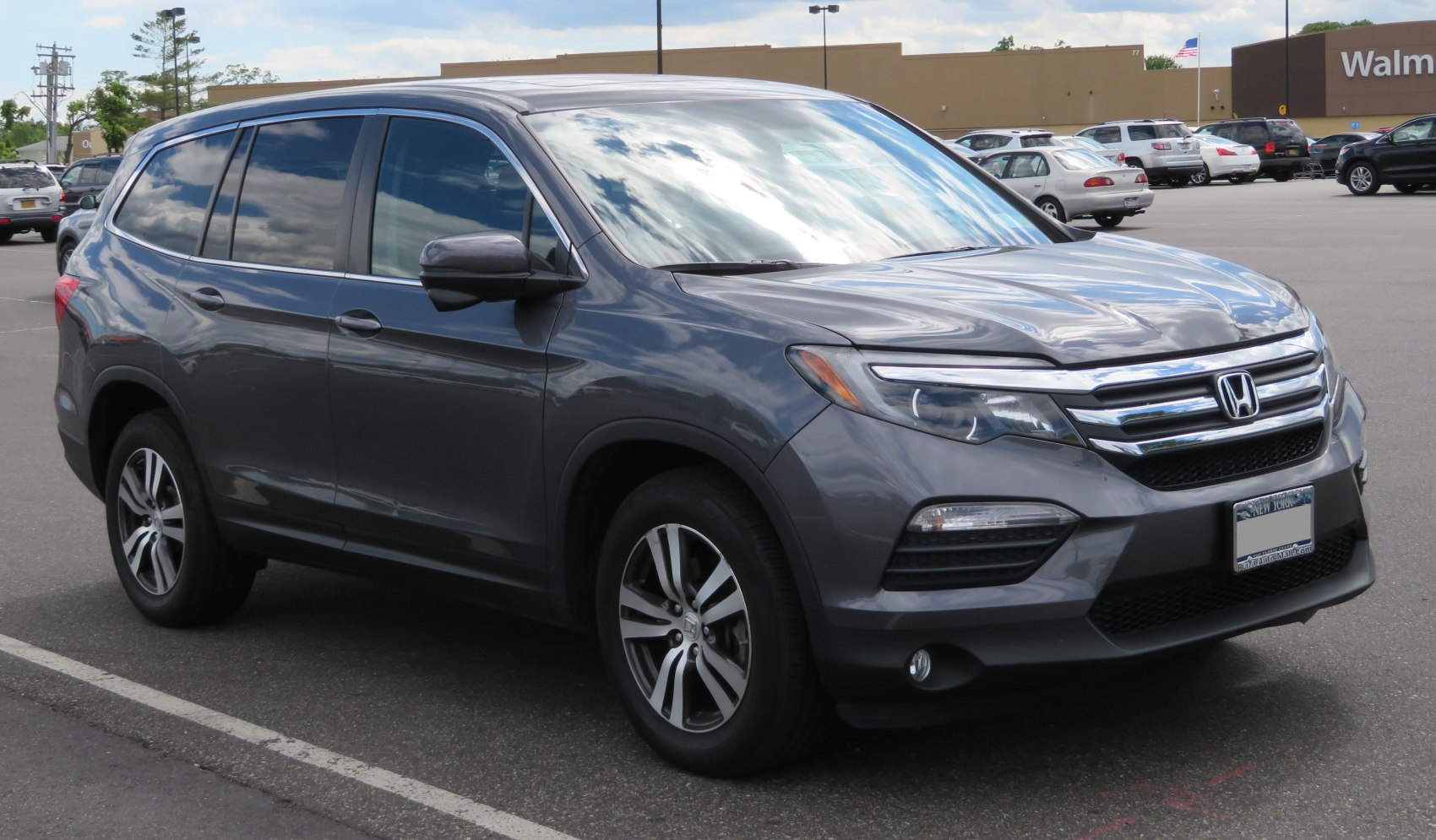 Mid-size SUV with LED headlights, alloy wheels, and tinted windows