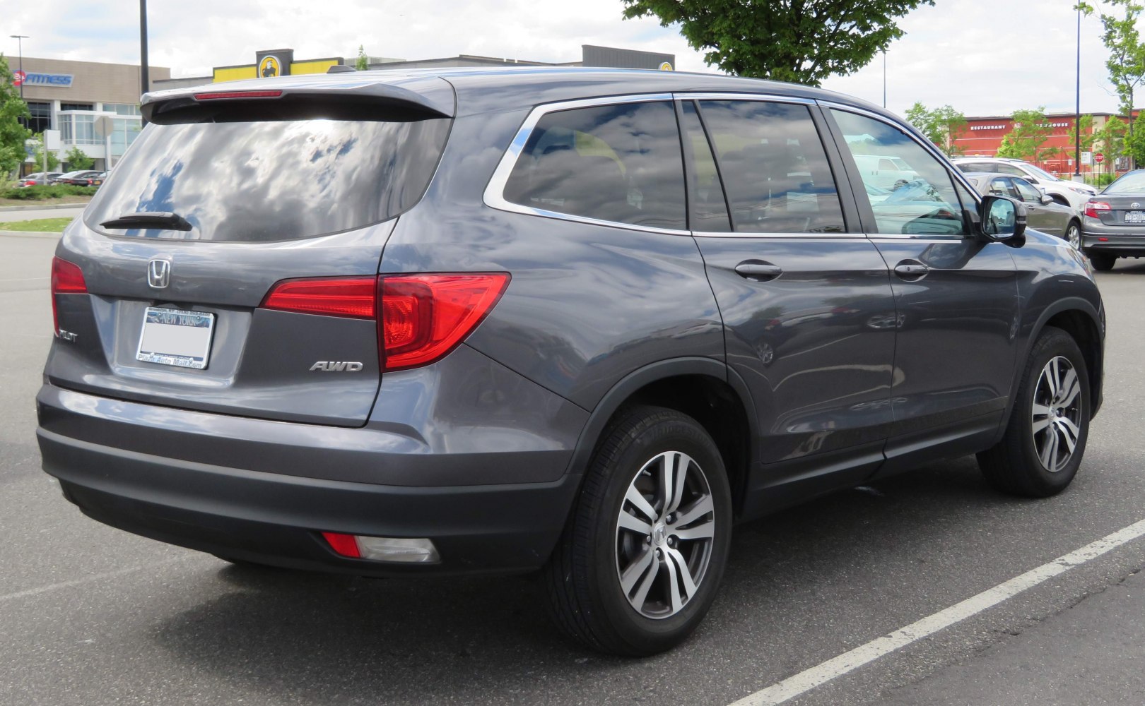 SUV rear side view with AWD badge and alloy wheels