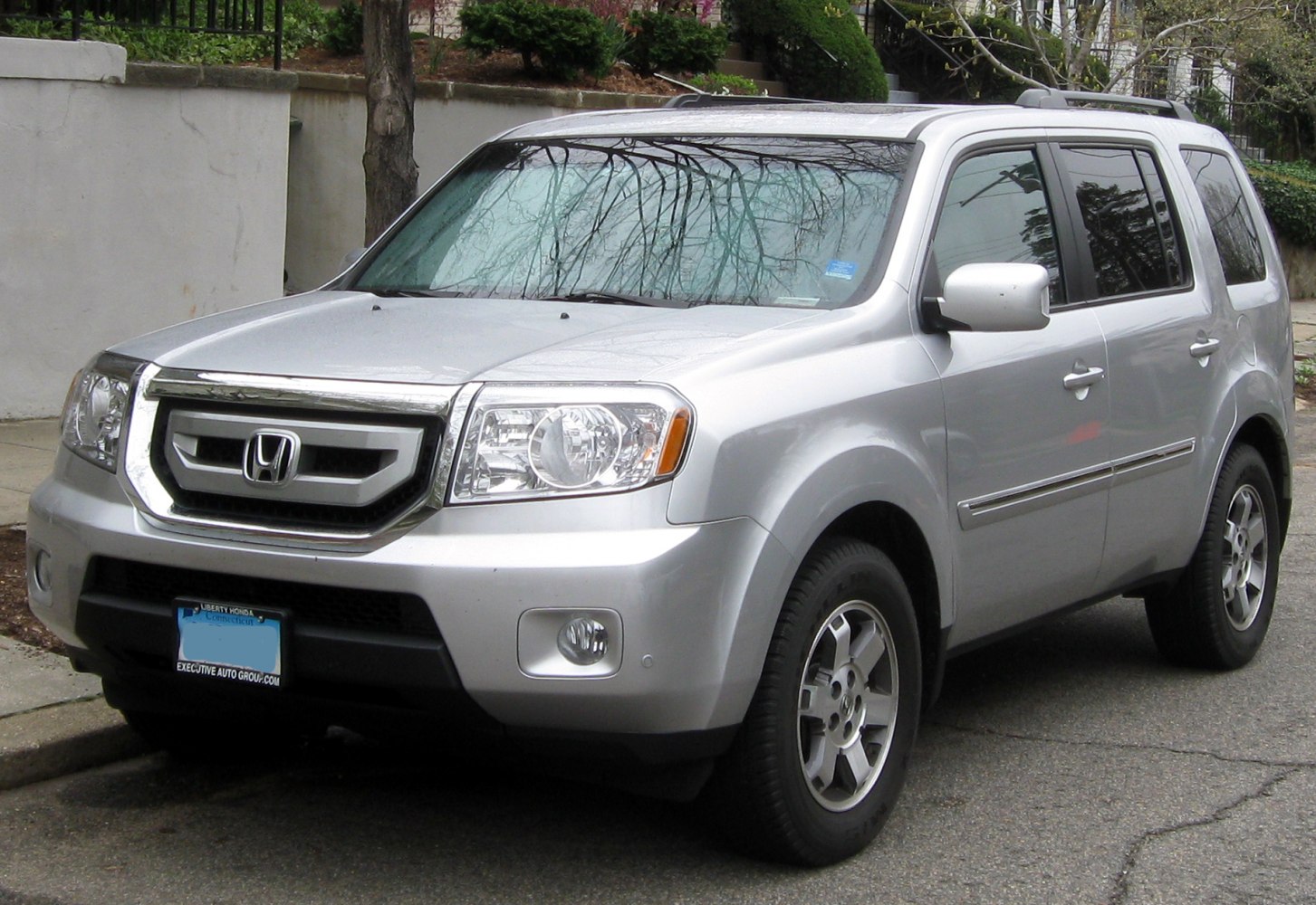 Mid-size SUV front view with bold grille and clear headlights