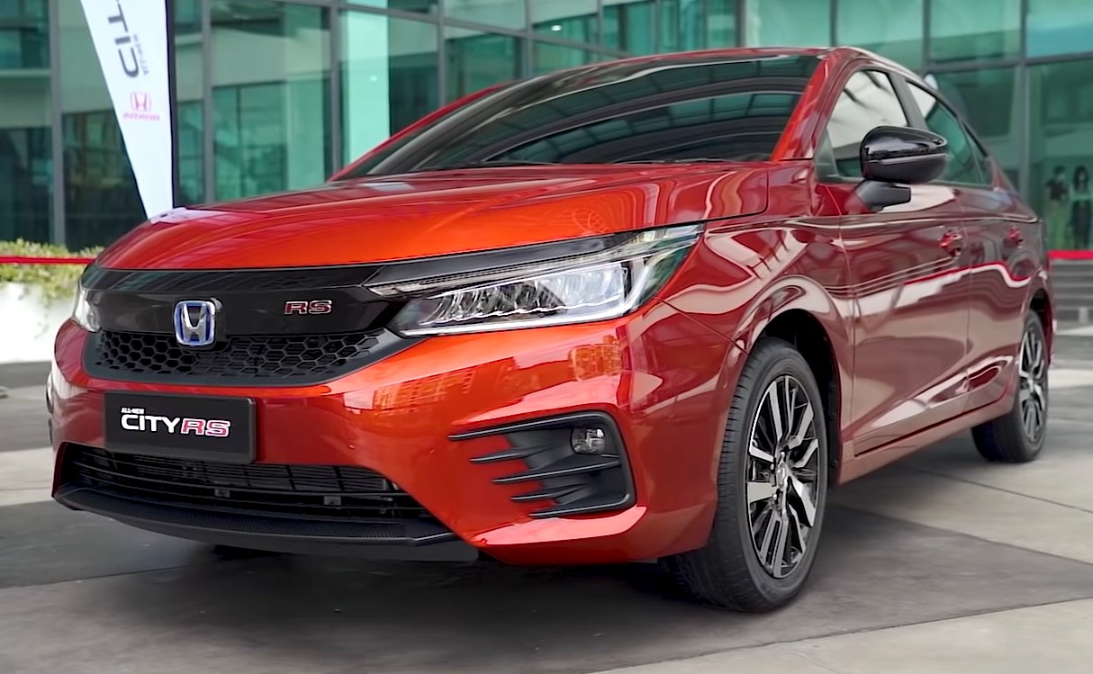 Sporty front fascia with sharp headlights and distinctive grille