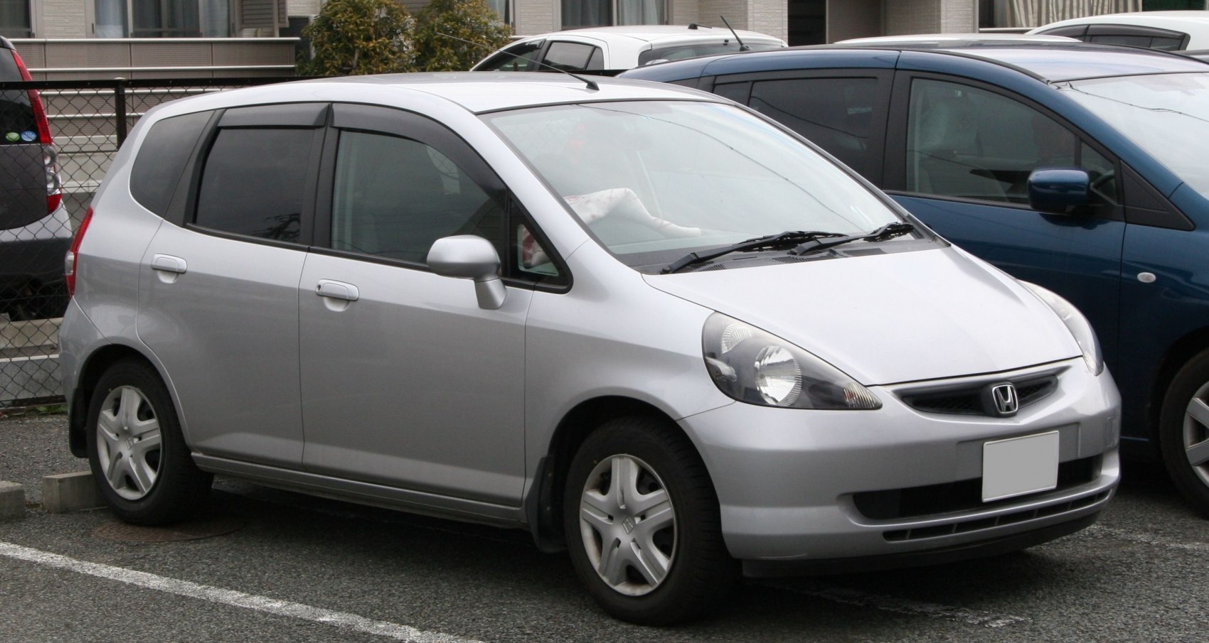 Compact hatchback with rounded headlights and five-spoke wheels