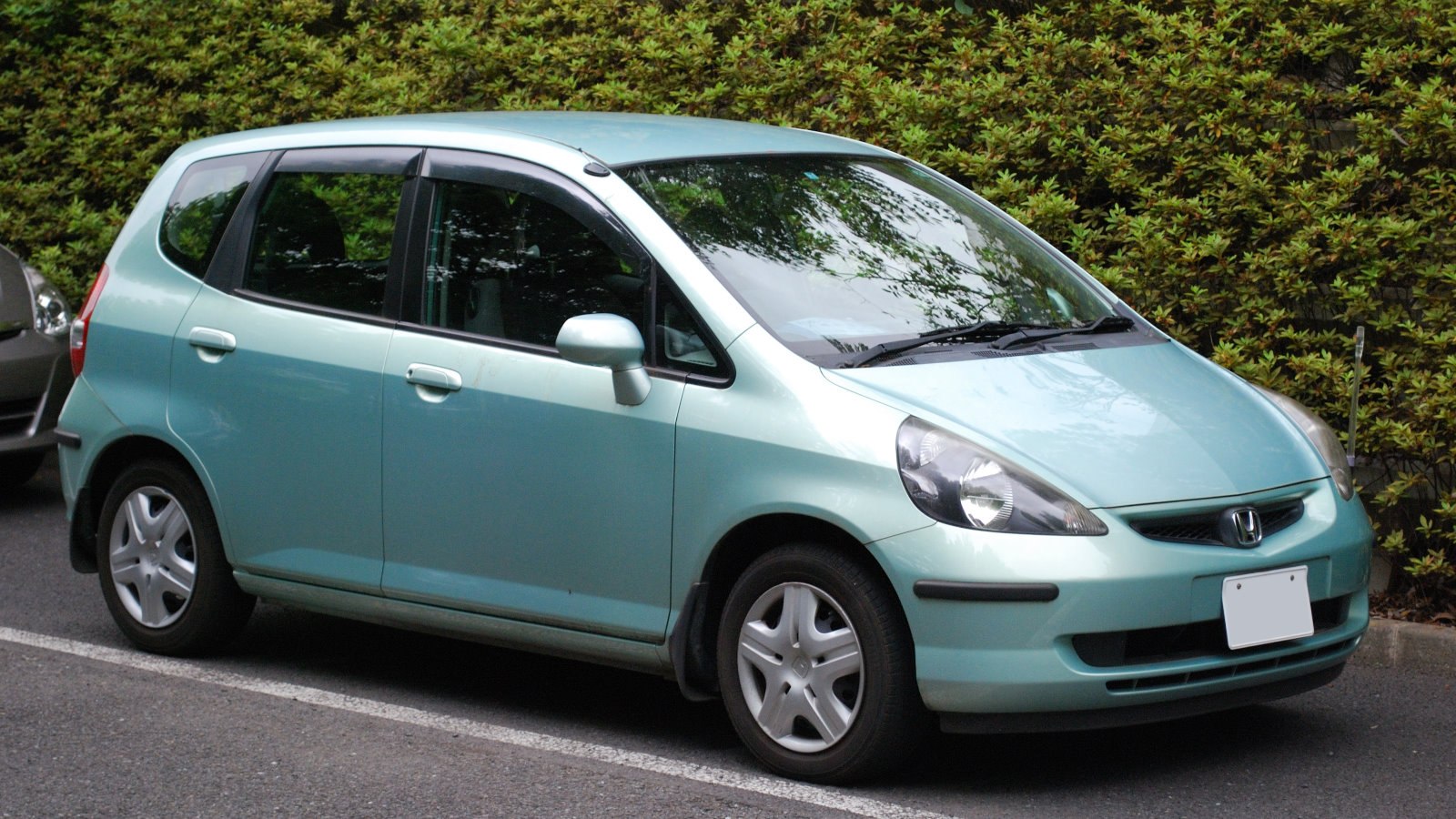 Compact hatchback with rounded headlights and five-door layout