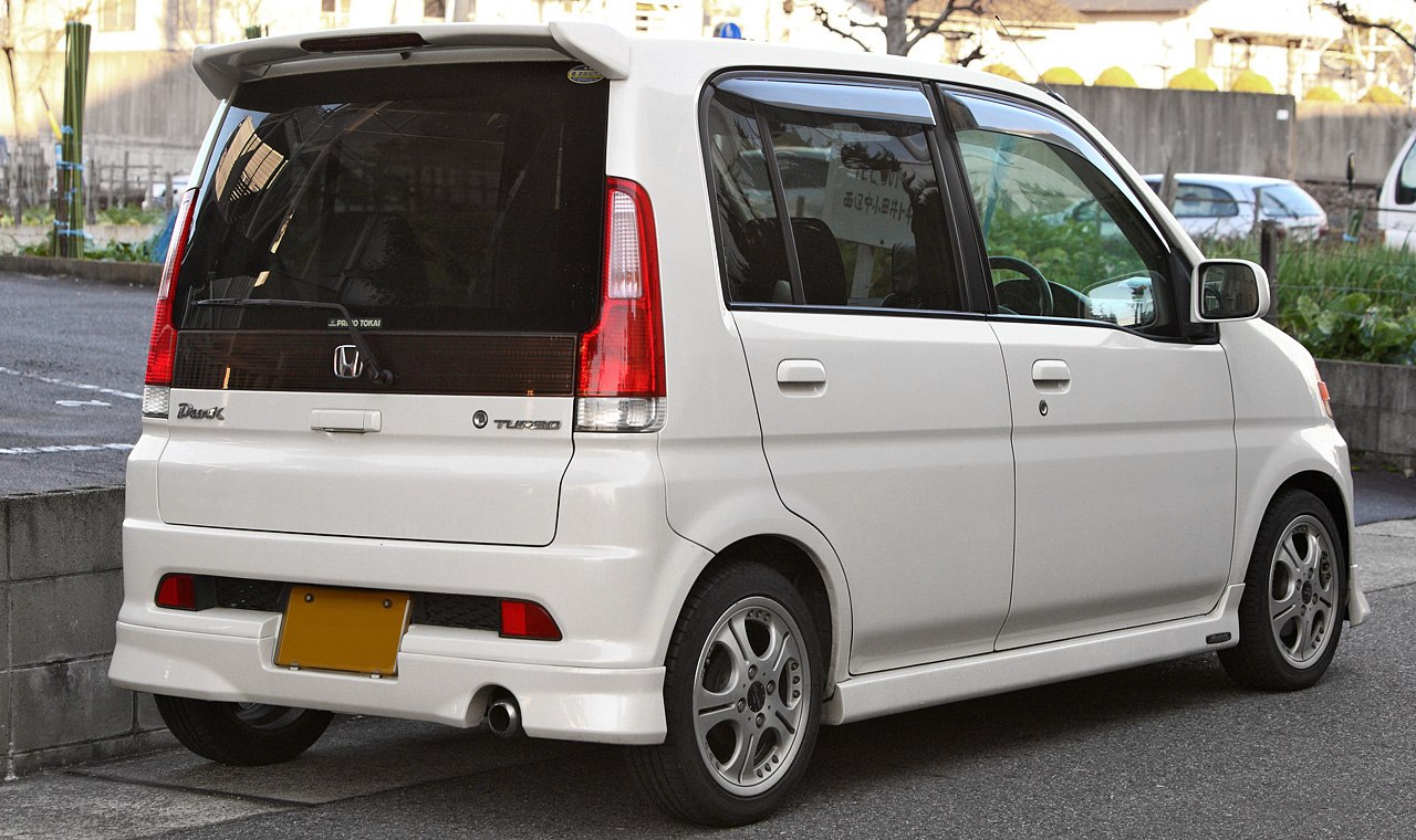 Compact hatchback rear view with turbo badge and alloy wheels