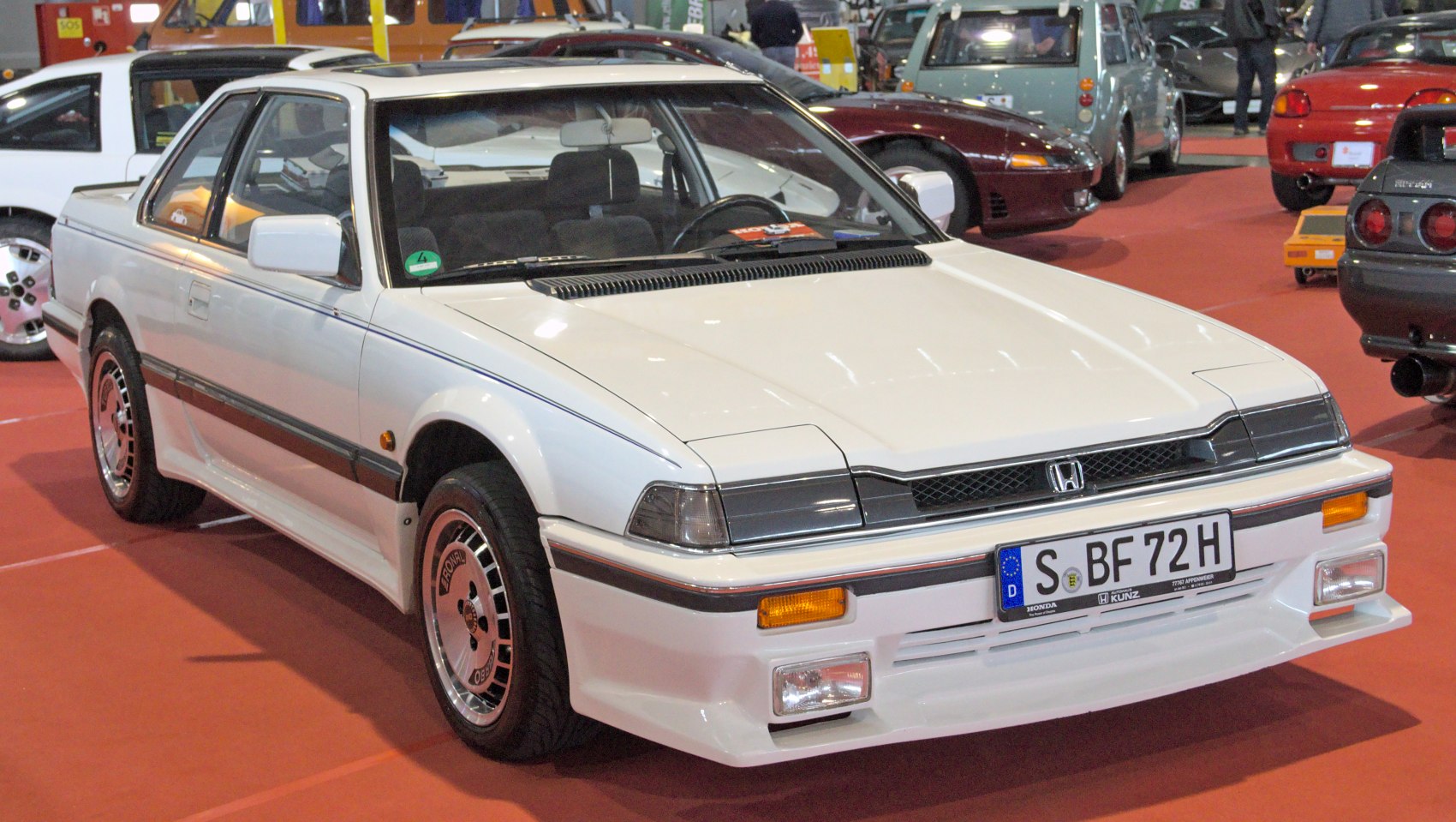 1980s sports coupe with pop-up headlights and alloy wheels