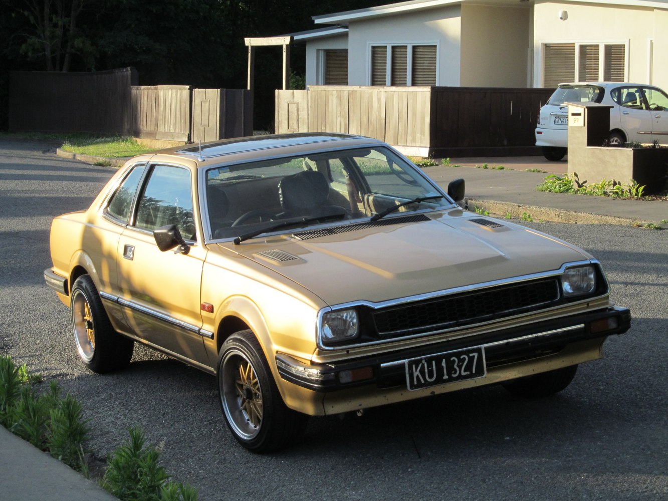 Front view of vintage two-door coupe with rectangular headlights