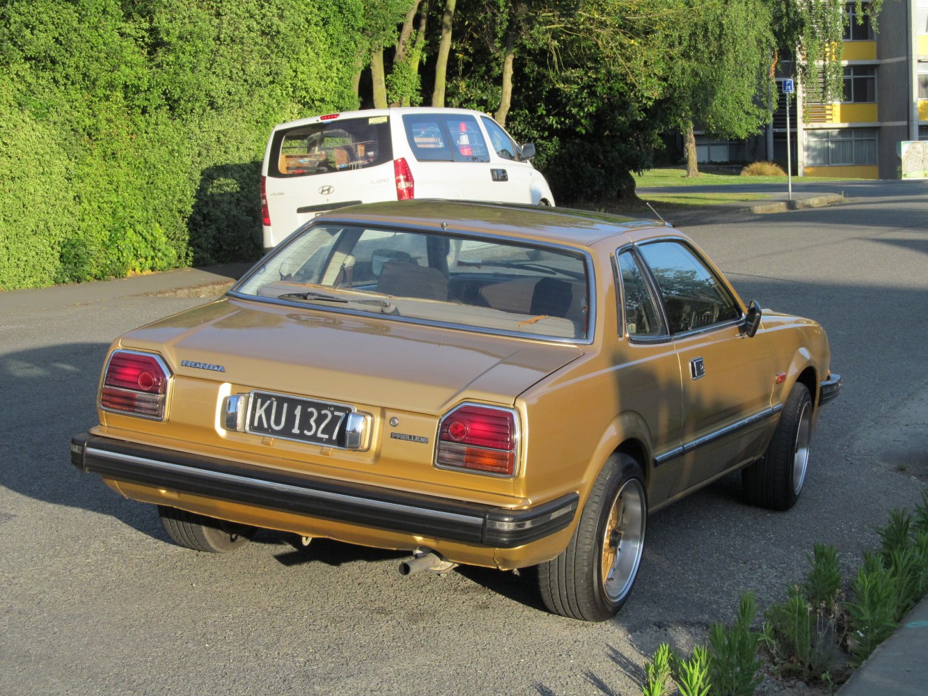Vintage coupe rear with distinctive taillights and classic bumper