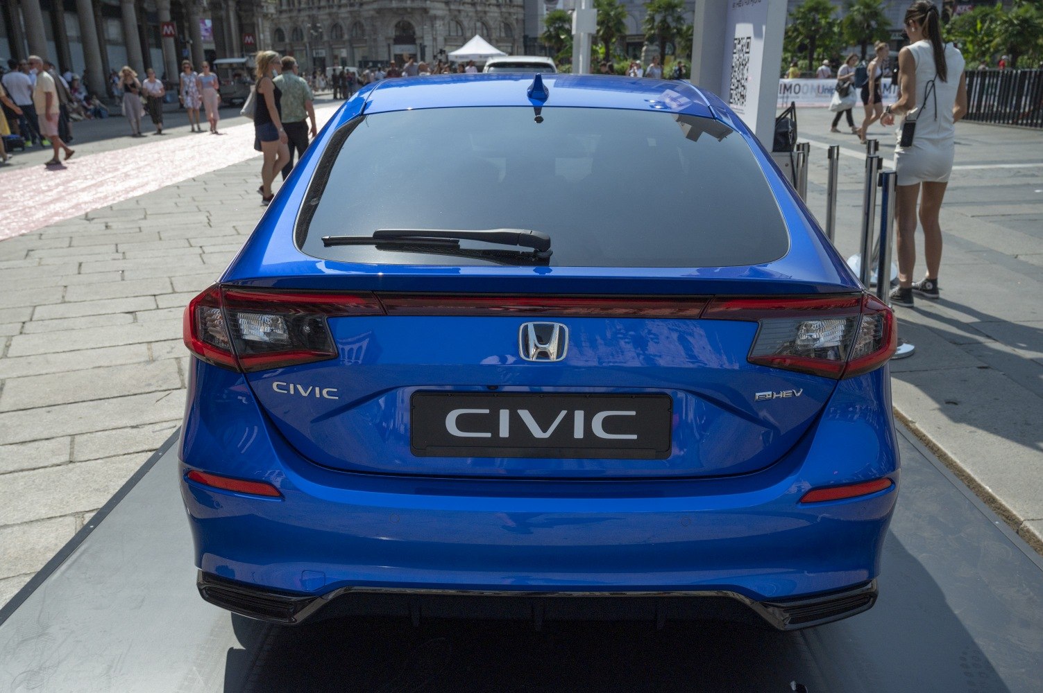 Rear view with hybrid badge, modern tail lights, rear windshield wiper