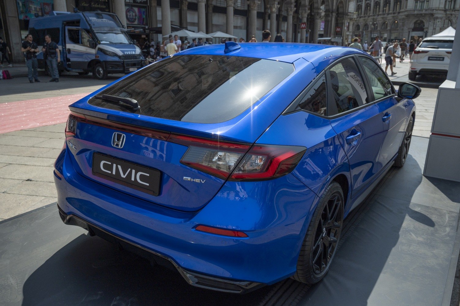 Rear hatchback with LED tail lights and rear spoiler in blue.