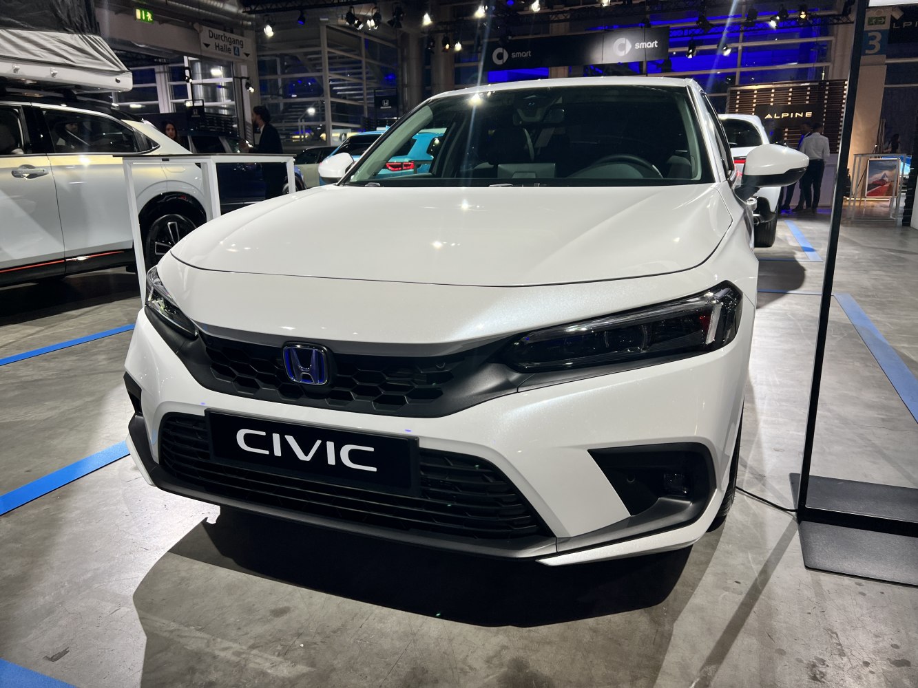 Front view with sleek grille and modern LED headlights