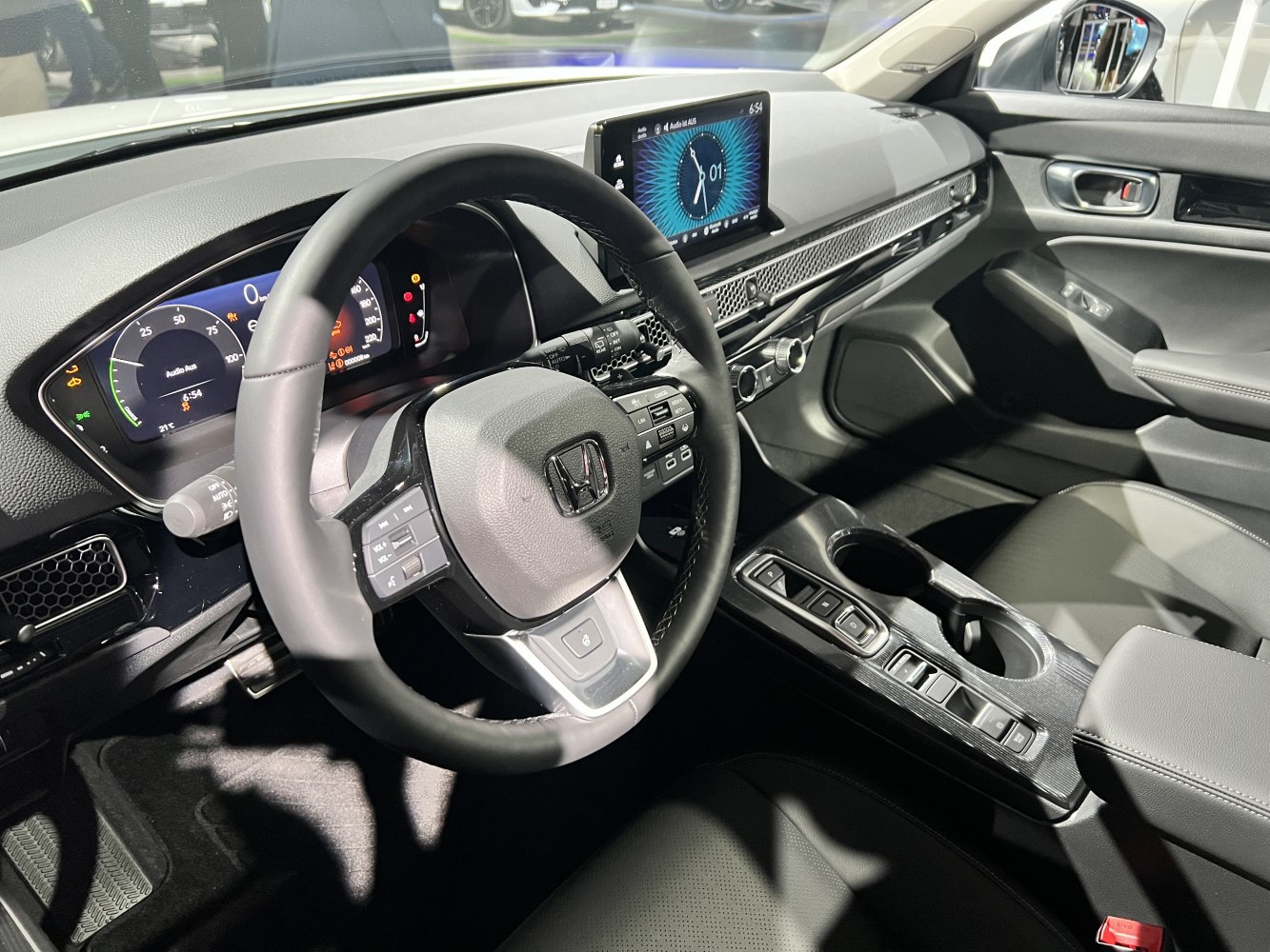 Digital instrument cluster and touchscreen infotainment in car interior