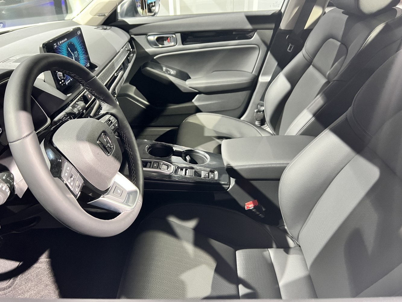 Modern car interior with leather seats and digital dashboard