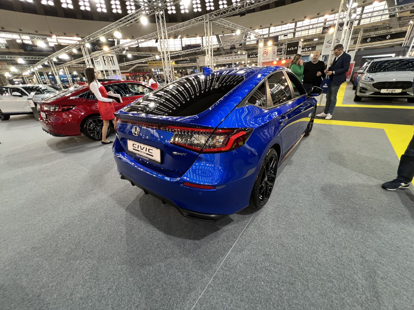 Rear view of a hatchback with LED taillights and black sporty rims