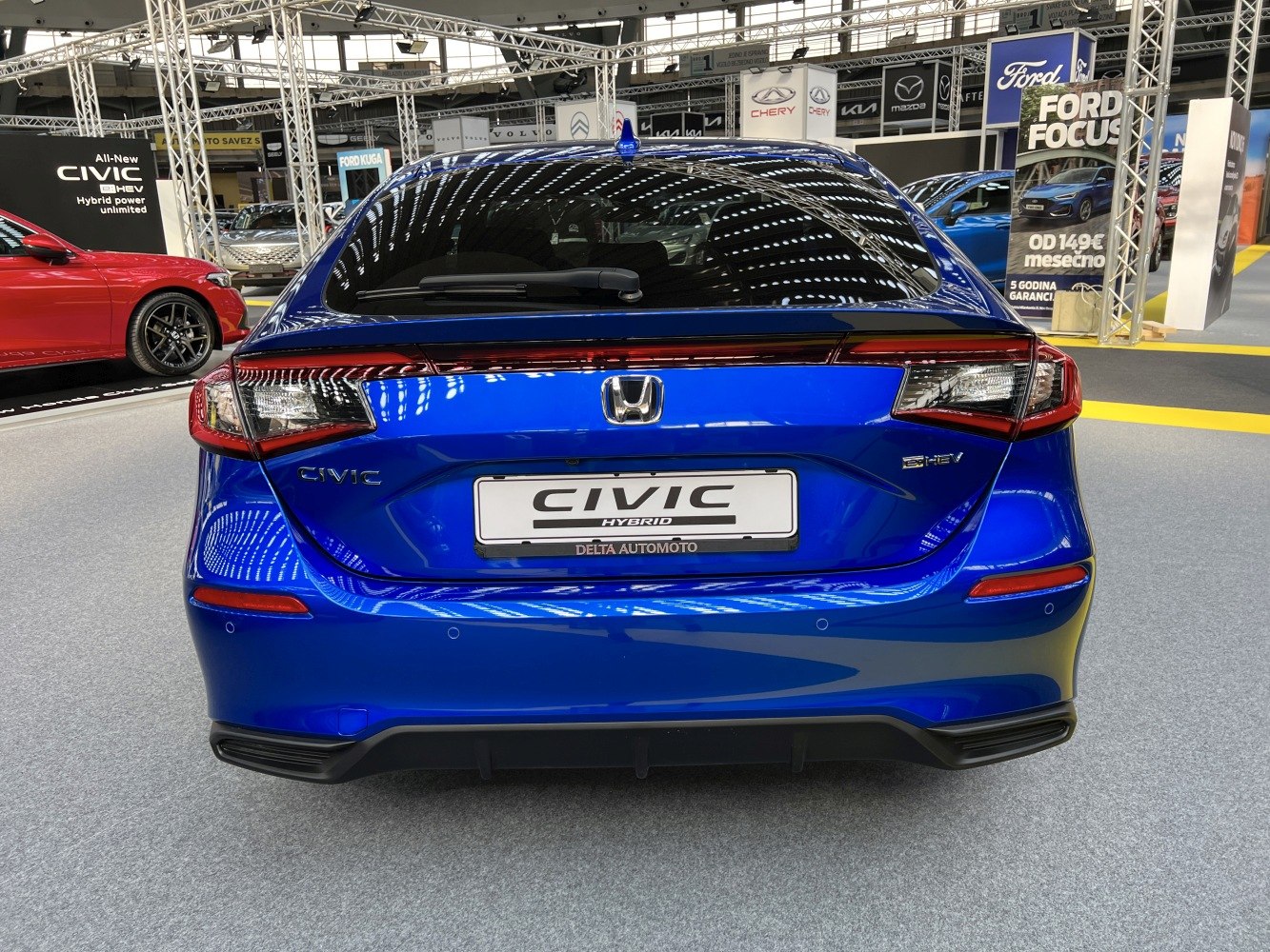 Blue hatchback with modern taillights and sleek rear design