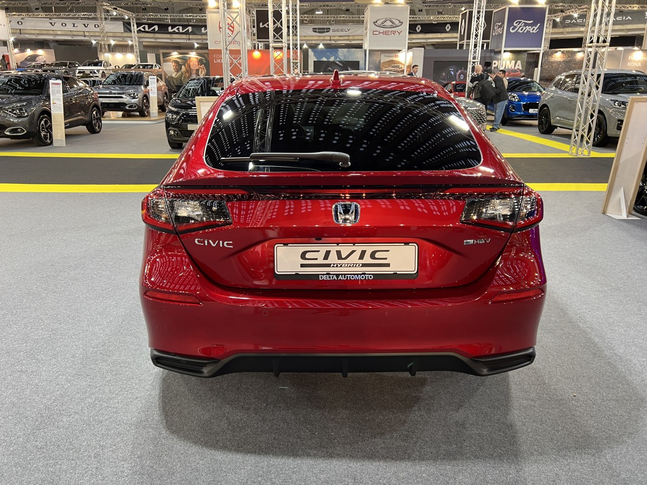 Rear hatchback design with distinct taillights and hybrid badging