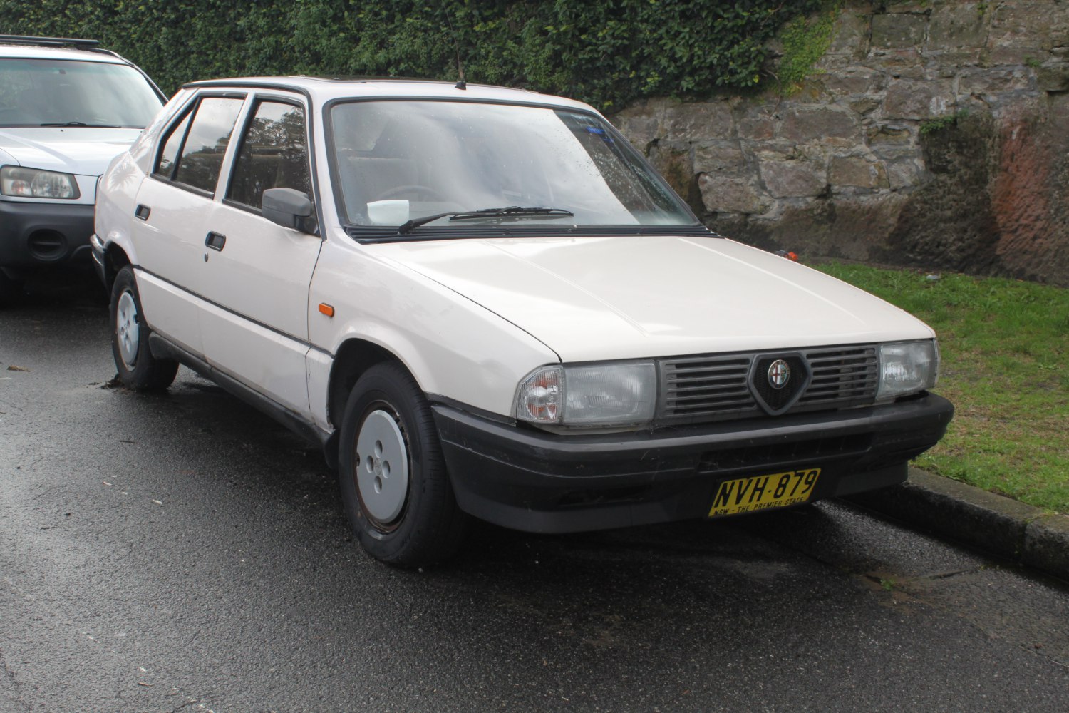 1980s boxy sedan with distinctive grille and rectangular headlights