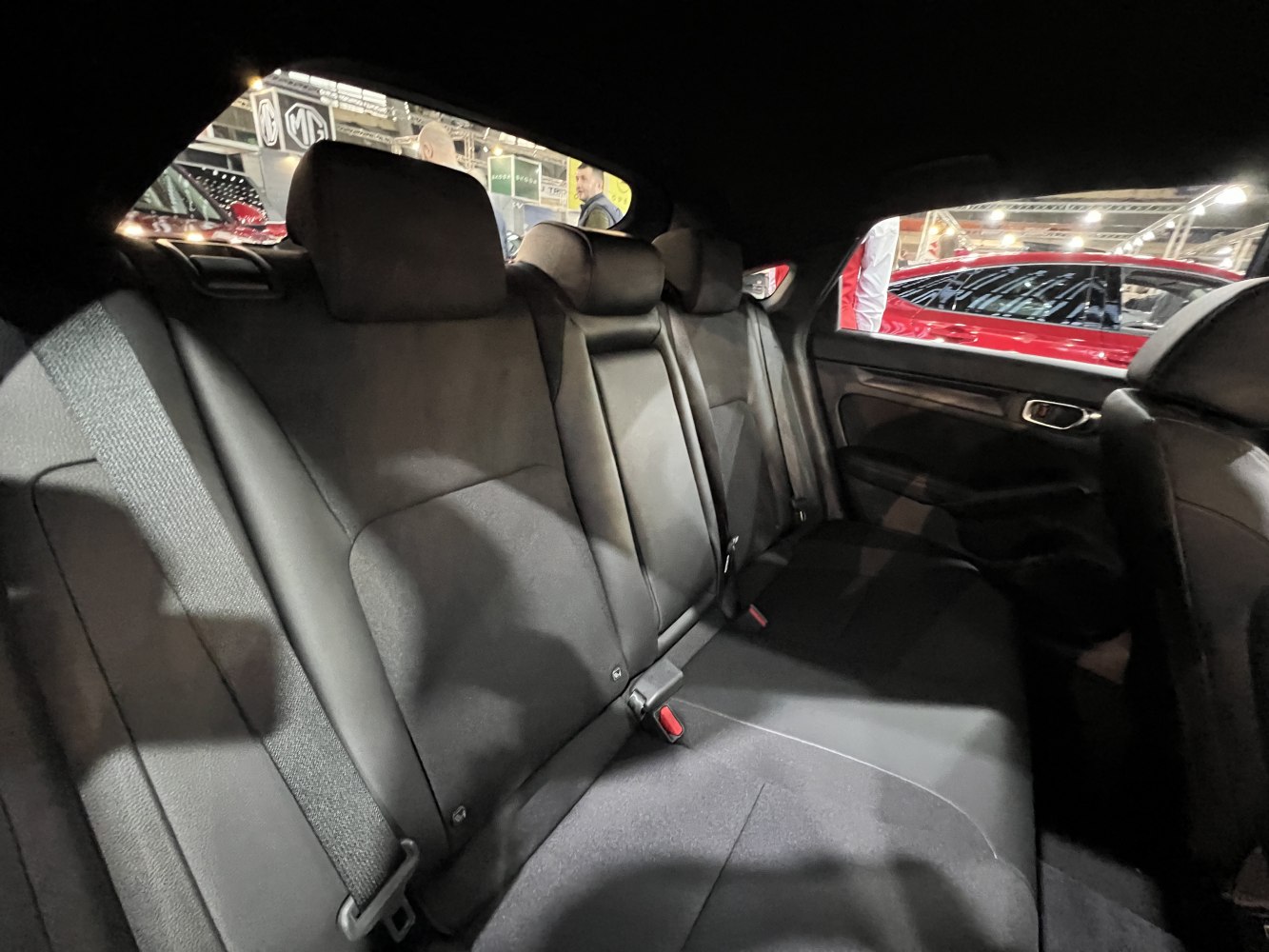 Spacious rear seating with black upholstery and seat belts