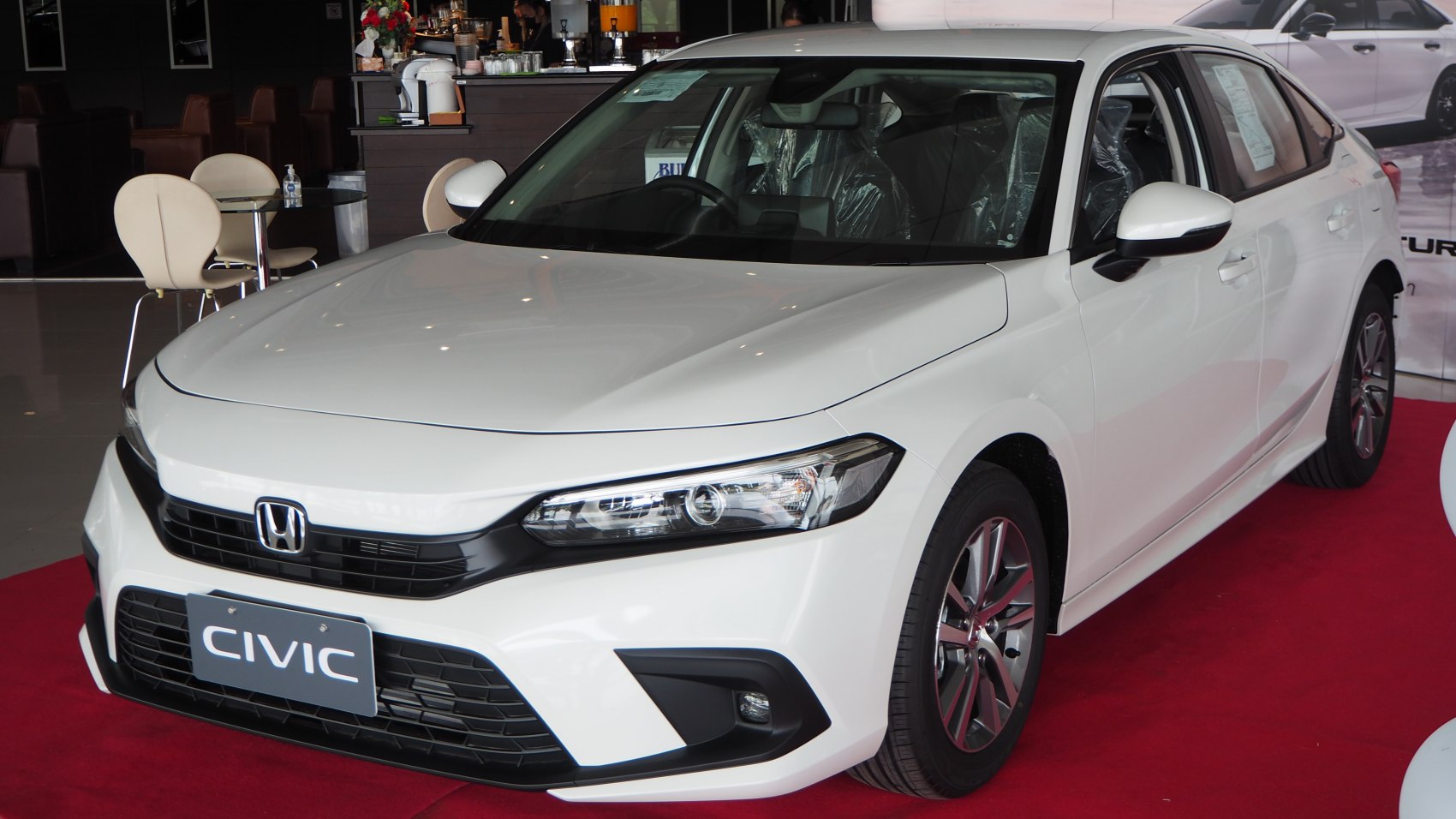 Front grille, headlight design, alloy wheels of a sedan