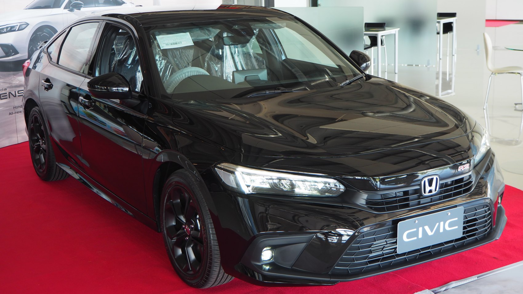 Black sedan with LED headlights and sporty black wheels